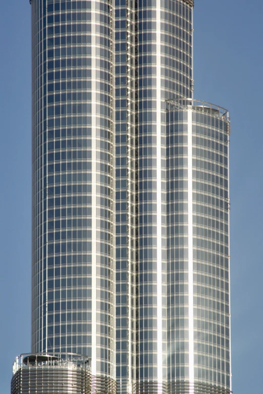 a tall skyscr in front of a blue sky