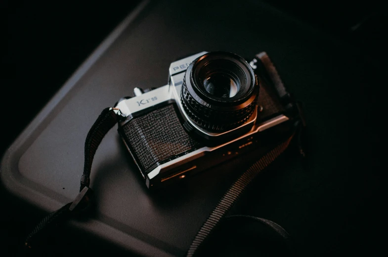 a close up of an old fashion camera on a table