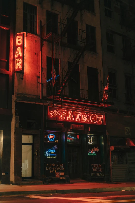 a bar on a city street at night time