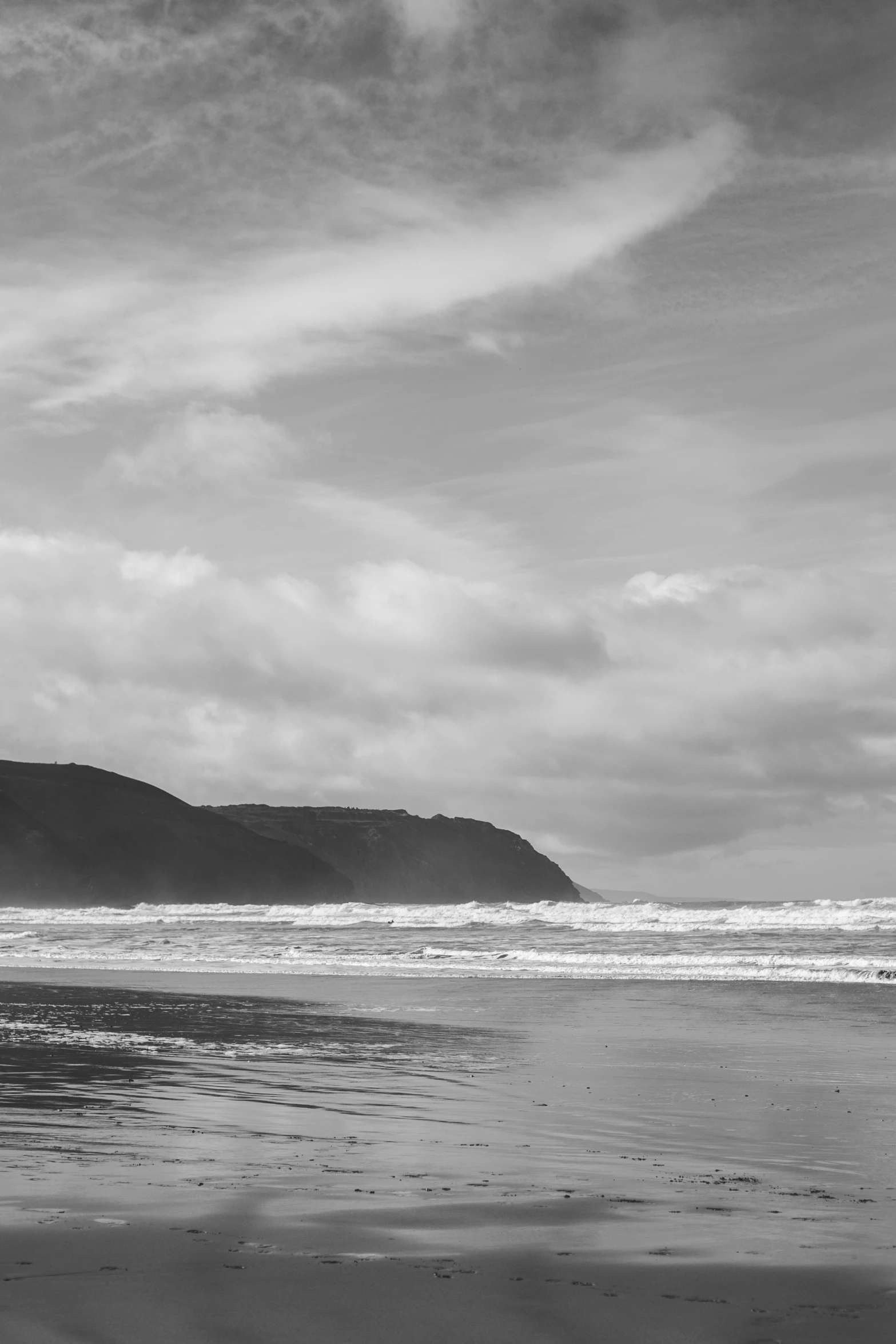 a man that is walking across some sand