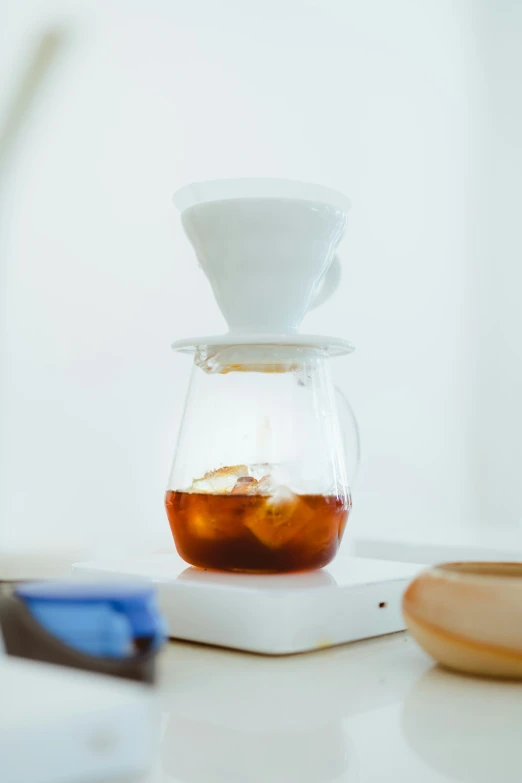 a carafe with liquid in it is sitting on a tray