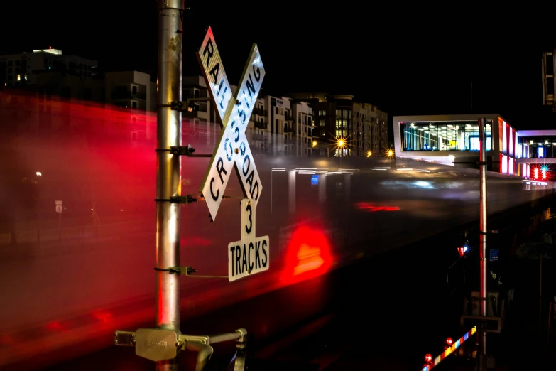 a train on a railroad track at night