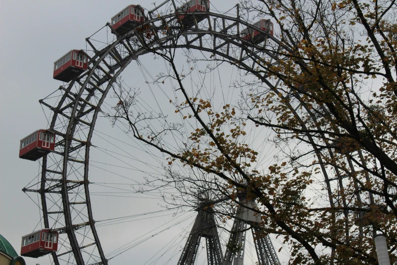 the amut park ferris wheel is shown against the blue sky