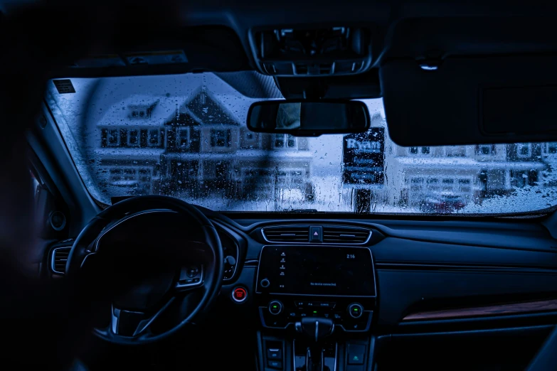cars inside a dark vehicle during winter driving
