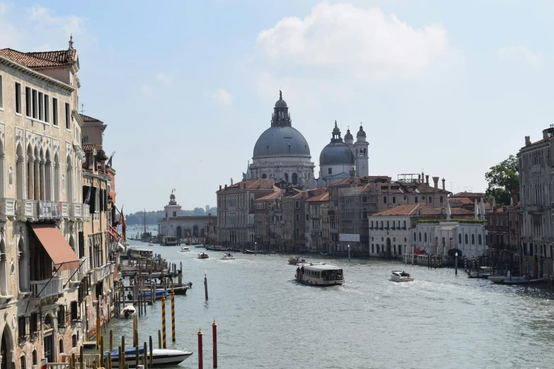 a waterway with boats and old buildings in it