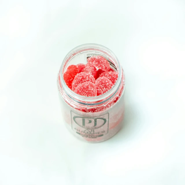 this is raspberry dessert in a small glass jar