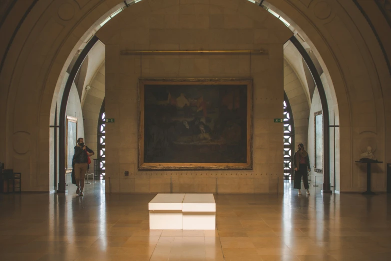 a group of people standing in a very large hall