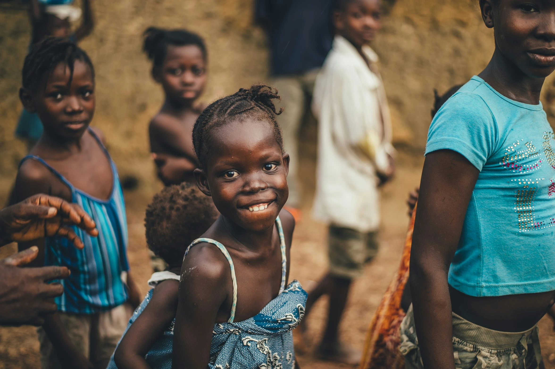 young children are posing for a pograph outside