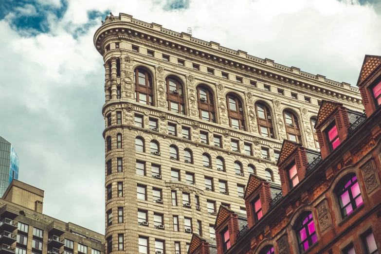 the building has many windows and is looking upward