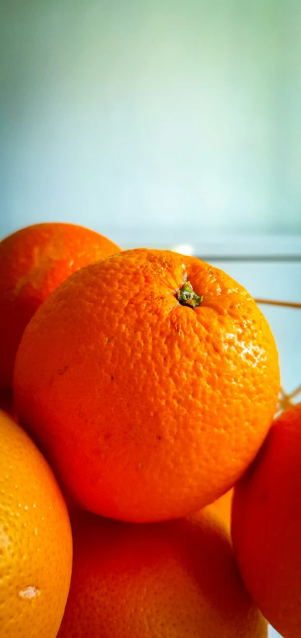 an orange is pictured on the table top