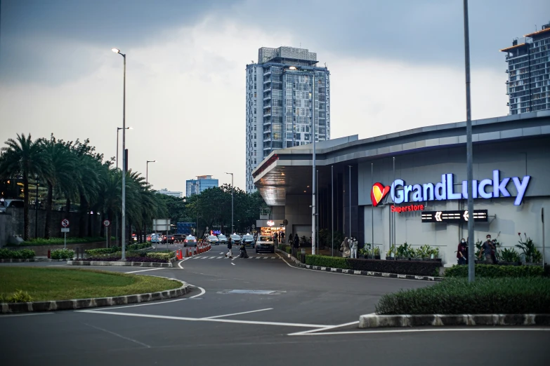 a group of people standing outside a big building