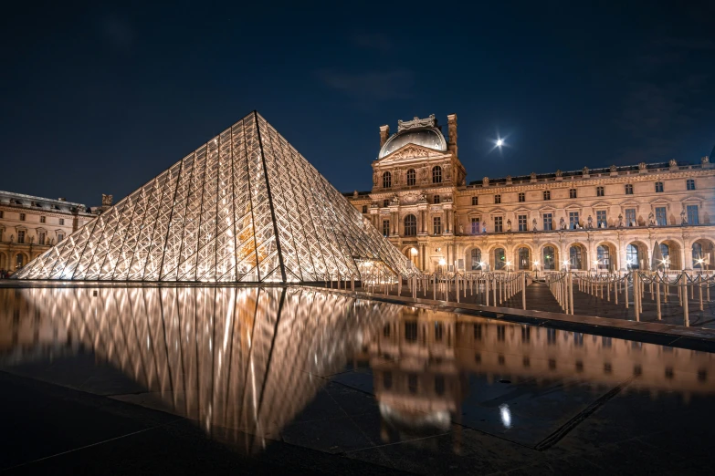 an ornate building with its roof lit up