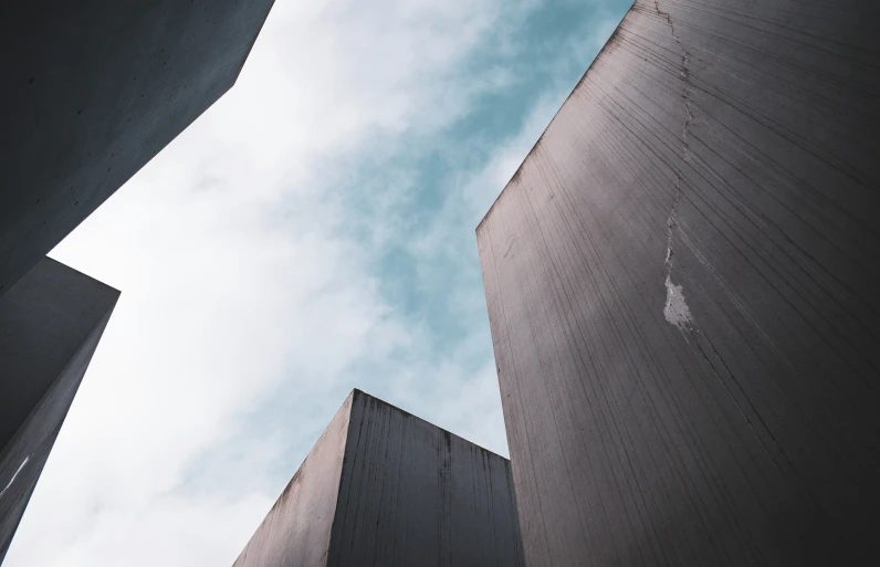 an upward view of a concrete building