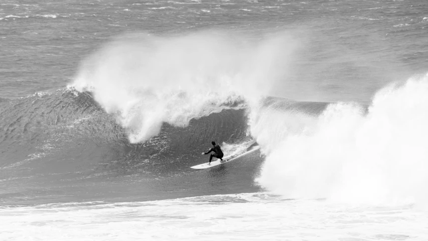 a person riding on top of a surfboard in the water