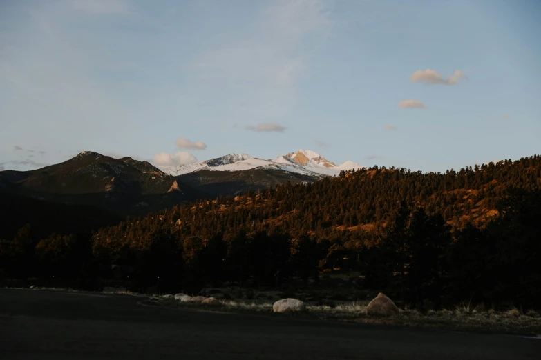 mountains at sunset with sun coming out on top