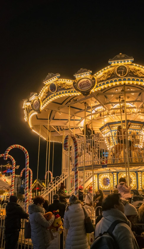 a large crowd of people on a carnival