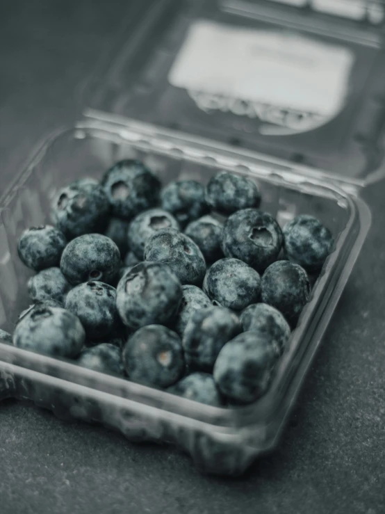 a plastic container that has some kind of fruit