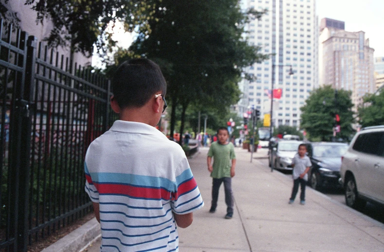 a group of men are walking down the street