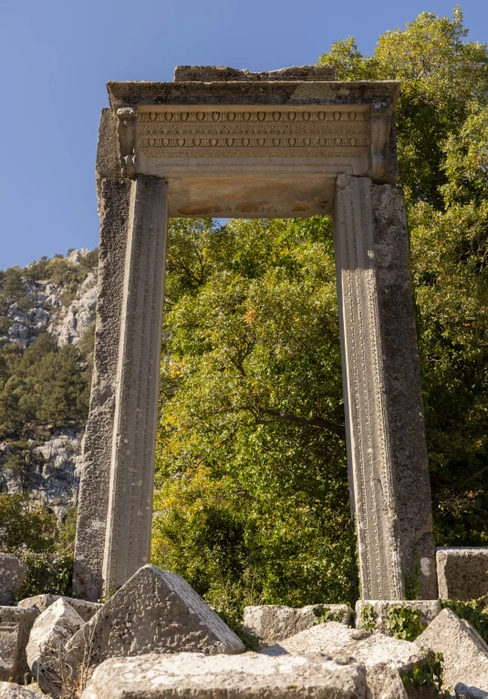 the stone structure is made of rocks and has intricate carvings