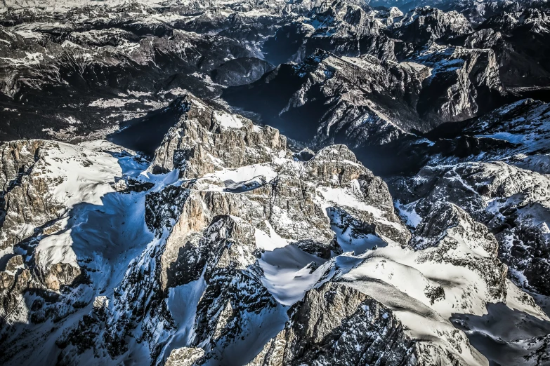 the top of some very big mountains covered in snow