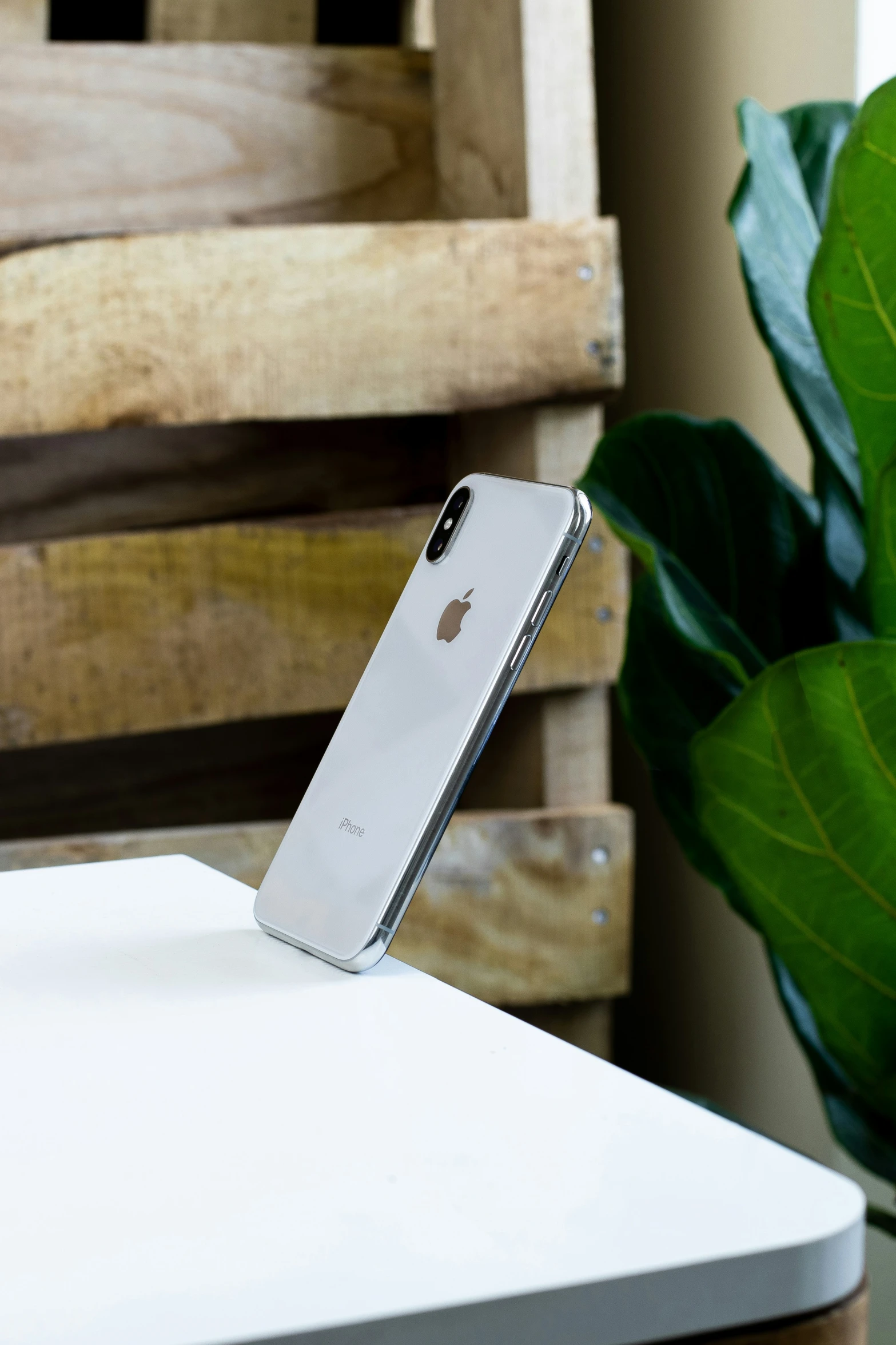 an iphone is sitting in its holder on a table