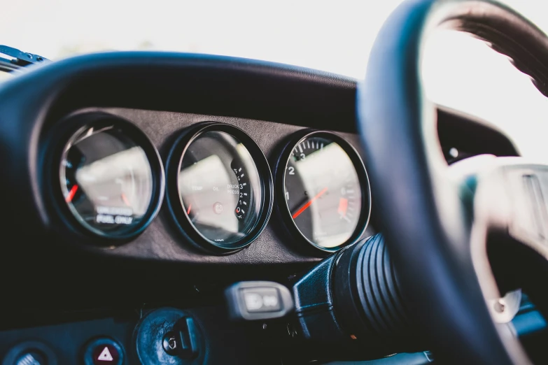 a view of the dashboard and steering wheel of a vehicle