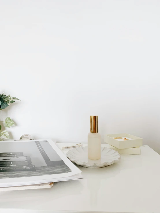 a magazine and some bottles sitting on a table