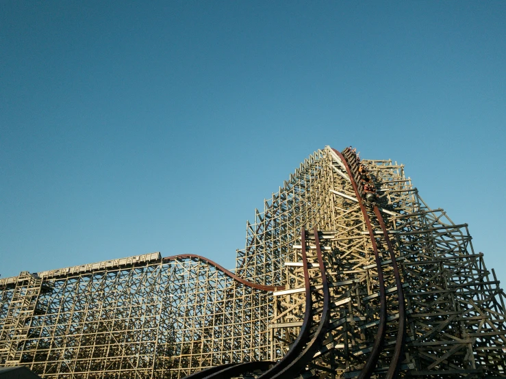 an image of roller coaster during a sunny day