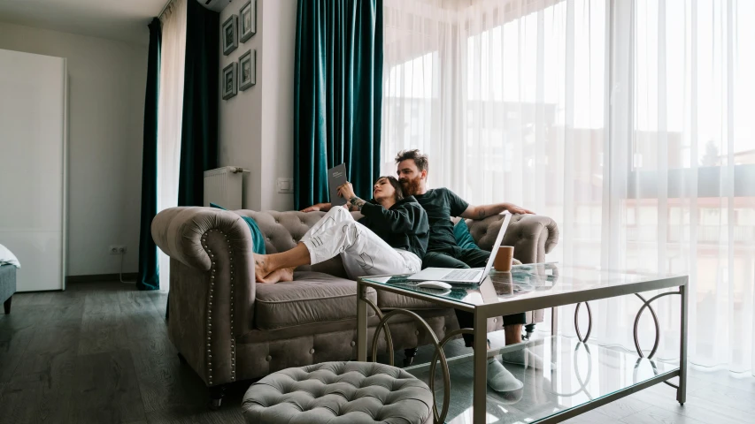 a man and woman in the living room of their home