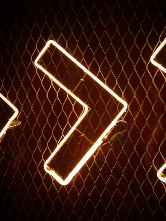 a neon sign with an arrow pointing up