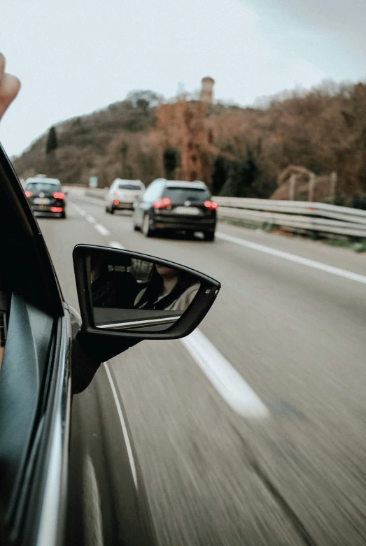 the view from inside of a car driving down a highway