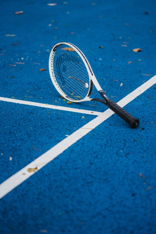 there is a tennis racket on the court