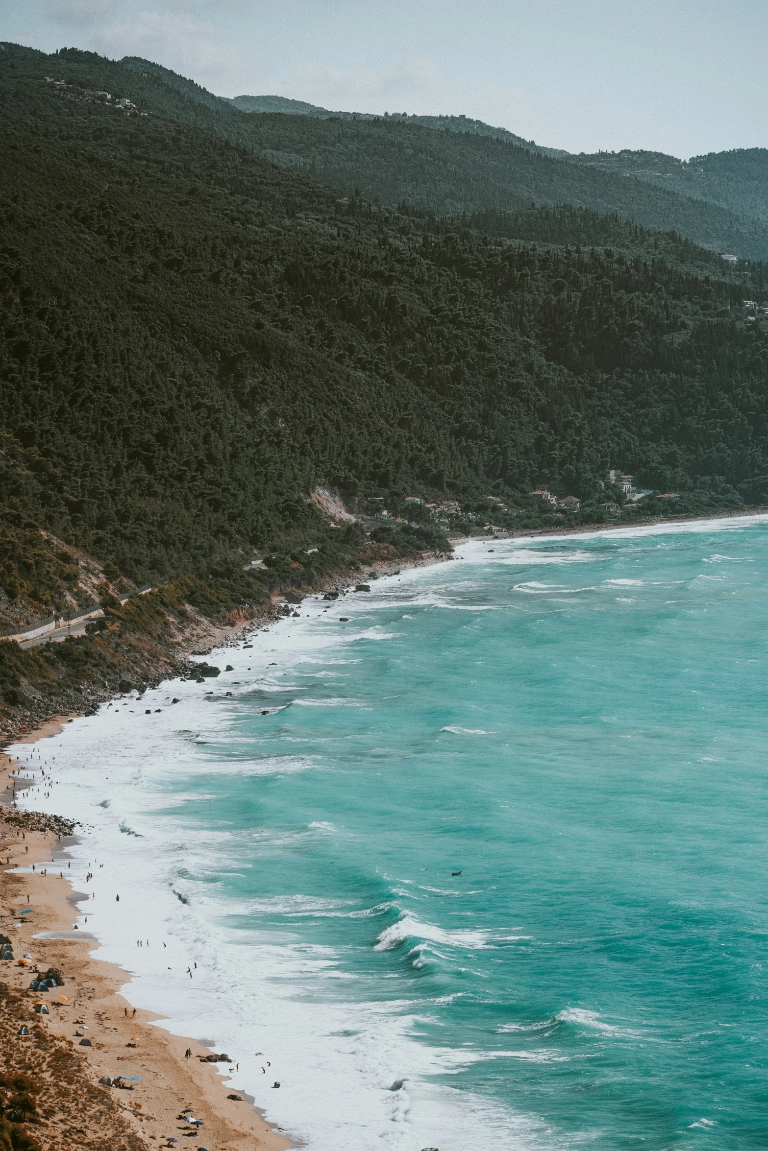 the beach is empty as one surfer comes out