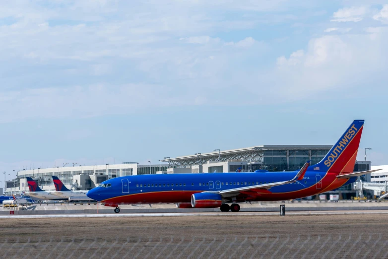 an airplane with blue and red stripes on the tail