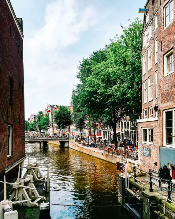 an canal running past a large brick building