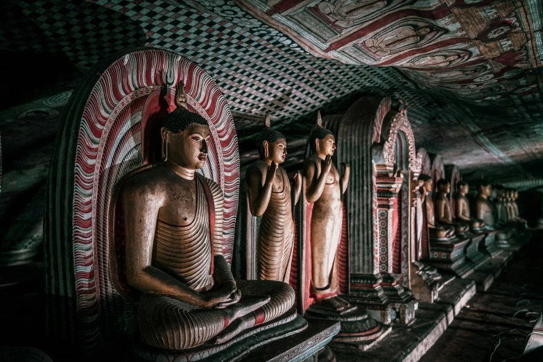 a line of buddha statues on display at the wattaya of buddhist buddhas in sri lanka