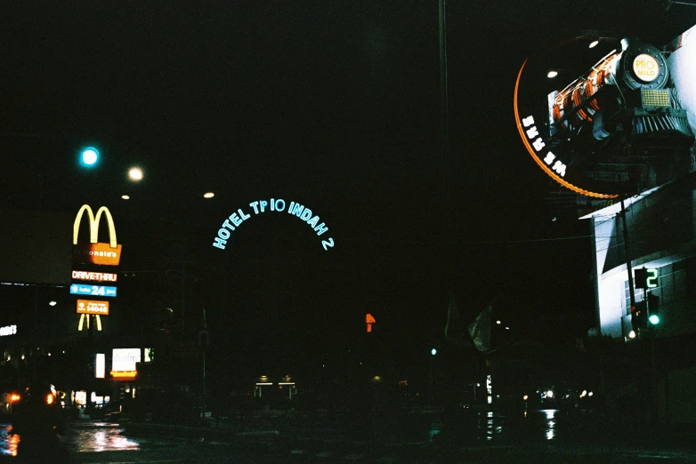 a street view of the entrance to the mcdonalds at night