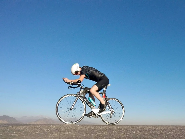 a cyclist is riding his bike in the desert