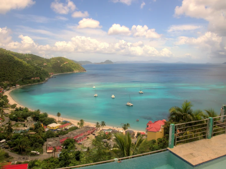 a beautiful bay filled with boats near an island