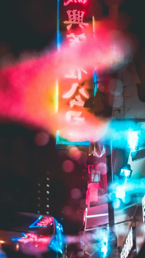 the view from a vehicle of a street at night