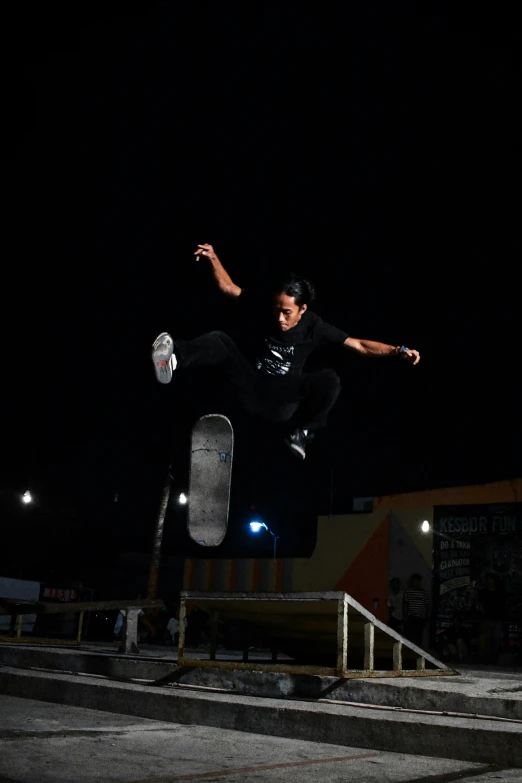 a man that is jumping in the air with a skateboard