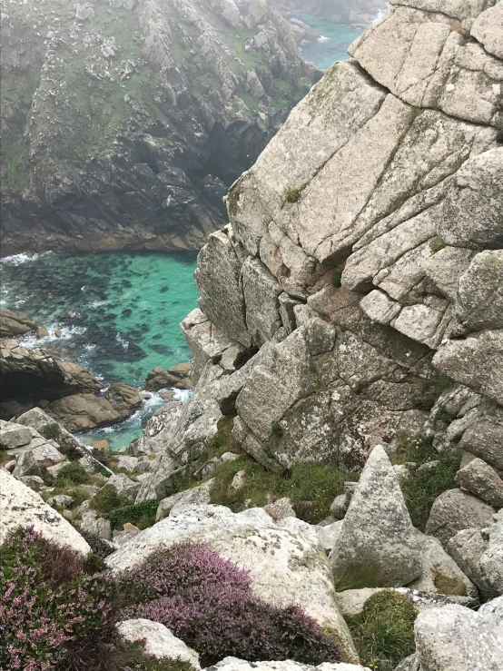 a scenic view from a rocky outcropping next to a small island