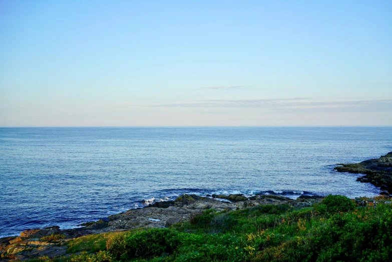 an ocean with a few waves rolling in