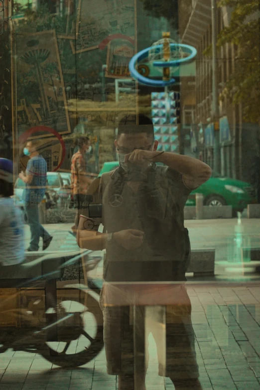 two men are standing on a city street