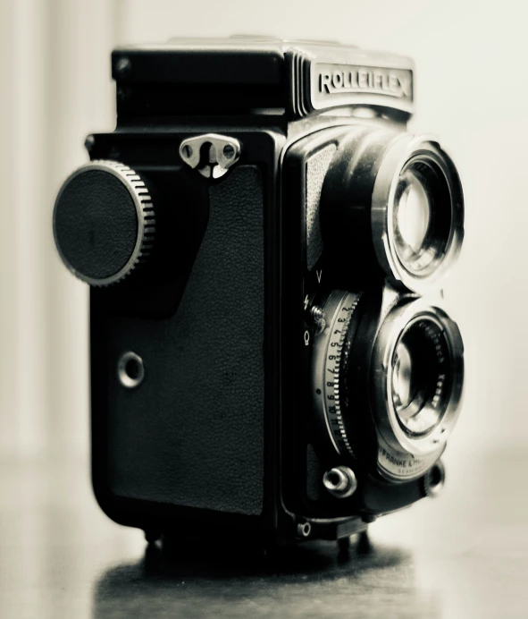 an old po of an old camera sitting on a table