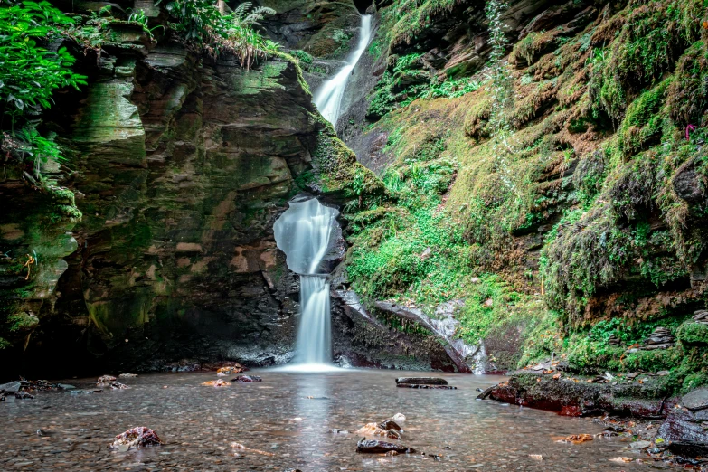 a view of a waterfall with water at the base