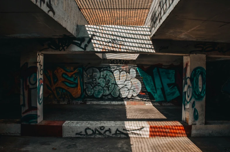 an old graffiti covered subway station in an alley