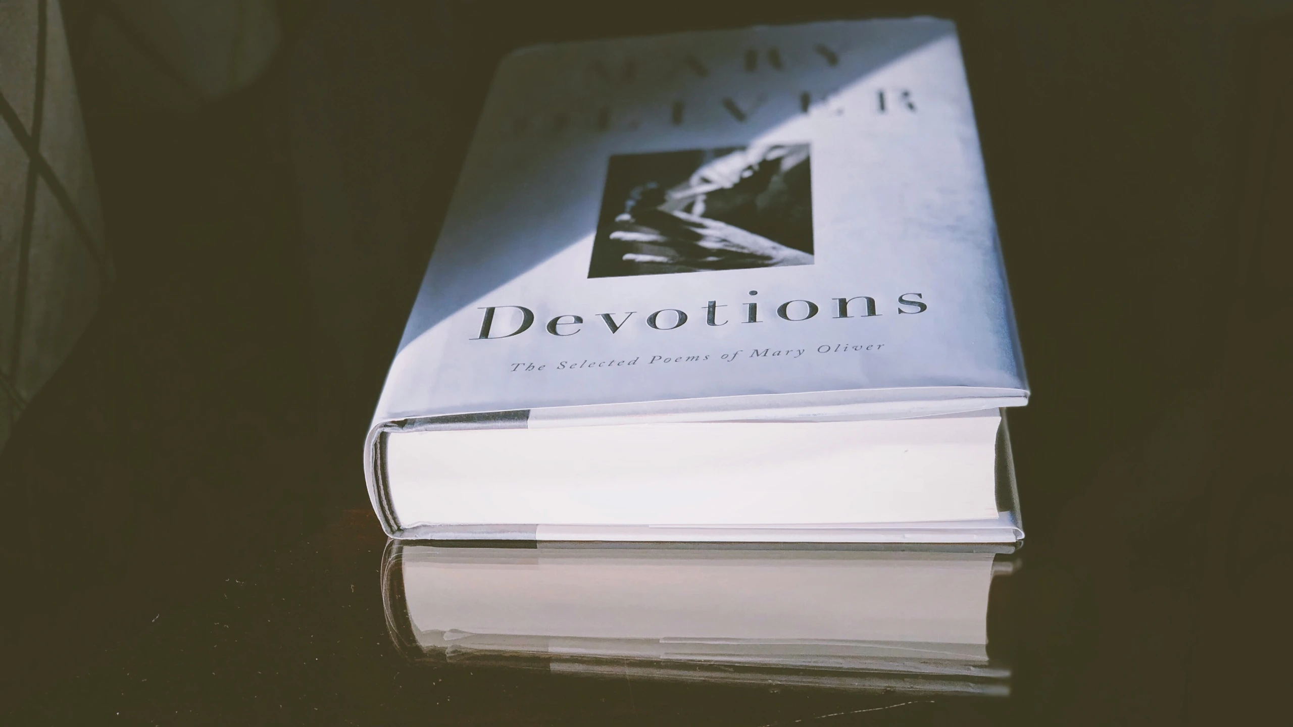 a stack of three books on a table