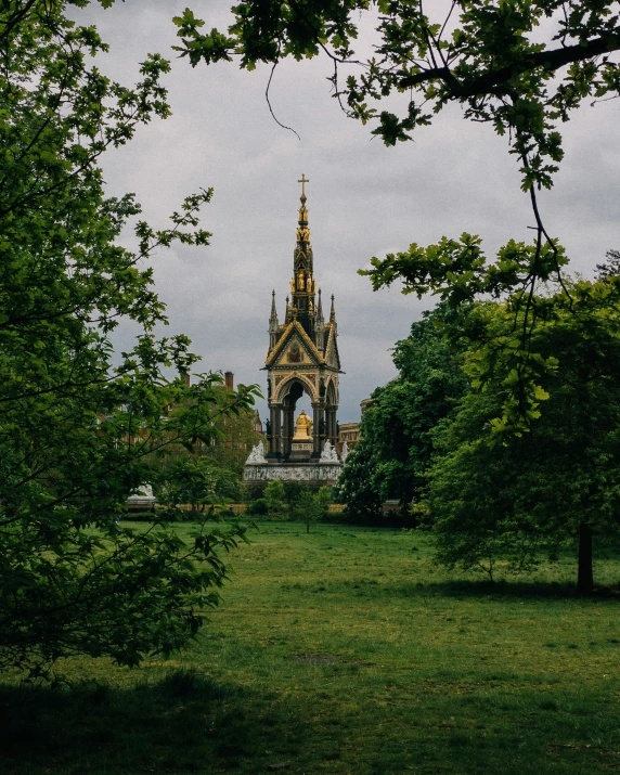 the large cathedral is surrounded by trees and a lawn