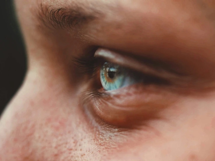 this is an extreme close up of a blue eye